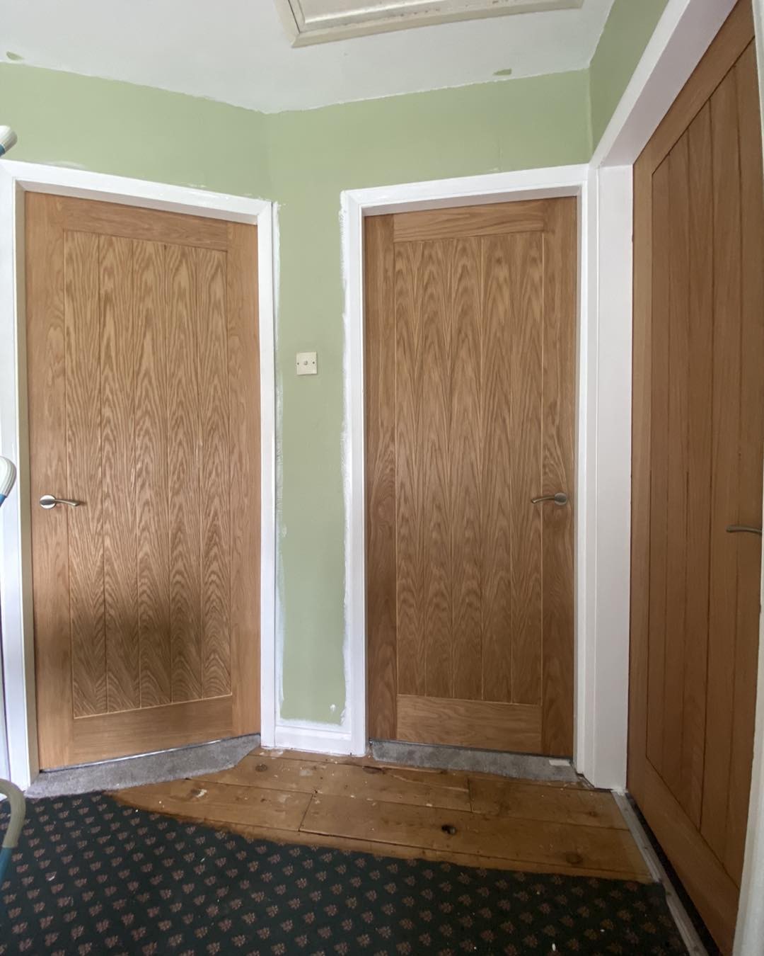 Two oak veneer internal doors on a landing