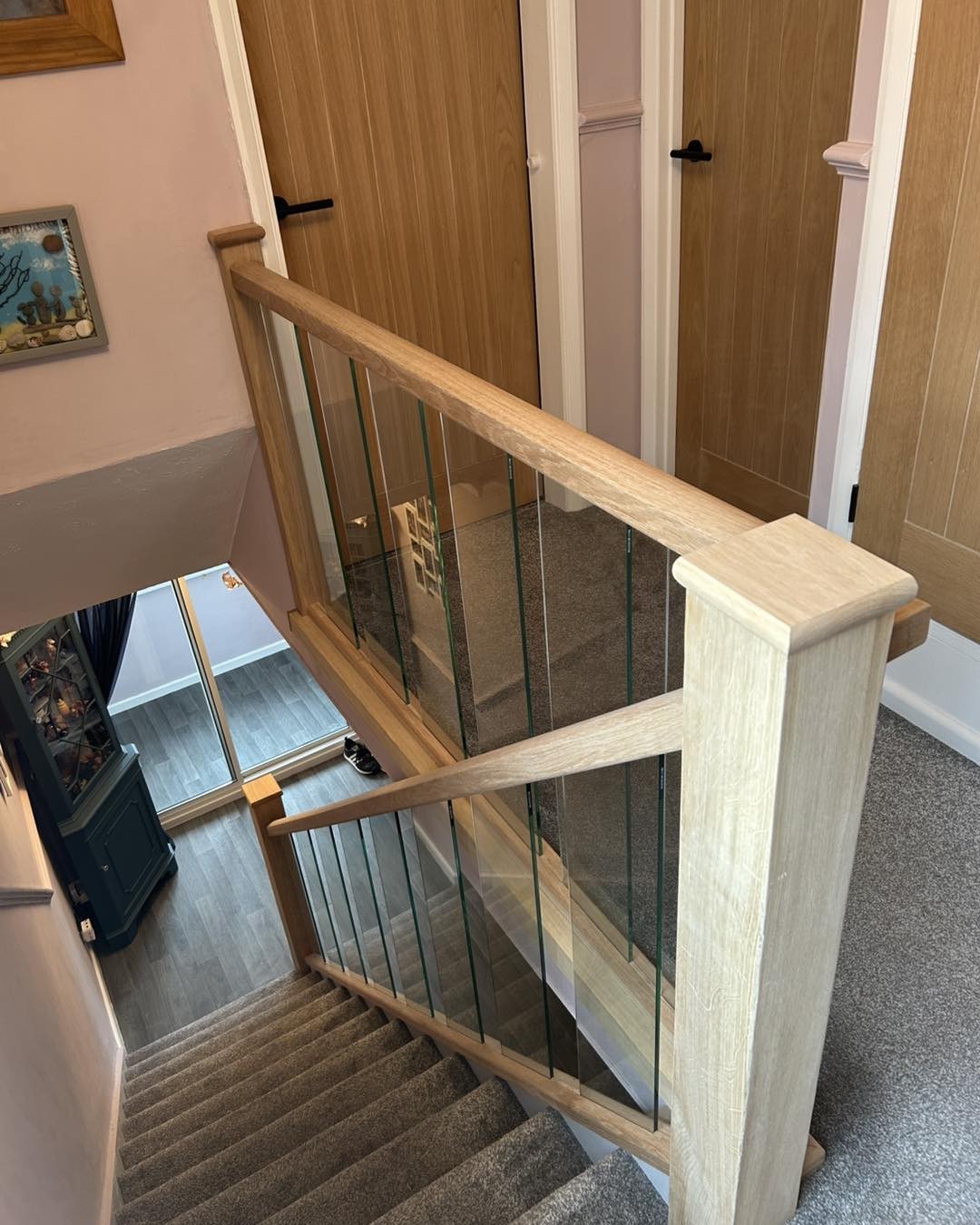 Oak and glass staircase seen from the landing